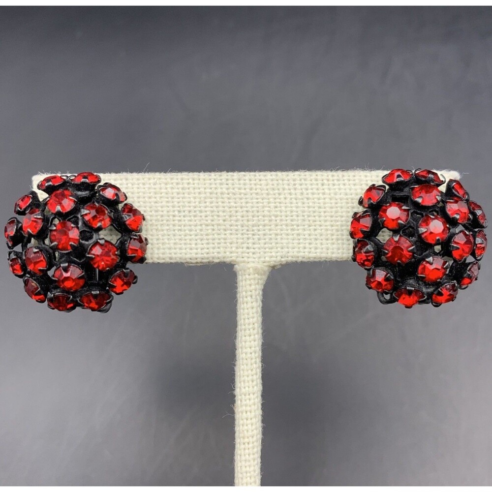Warner Clip On Earrings Red Rhinestone Black Metal Round Domed Signed Vintage